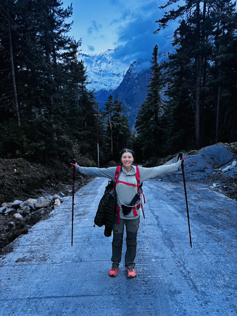 Anca with arms outstretched on a path in Annapurna Nepal