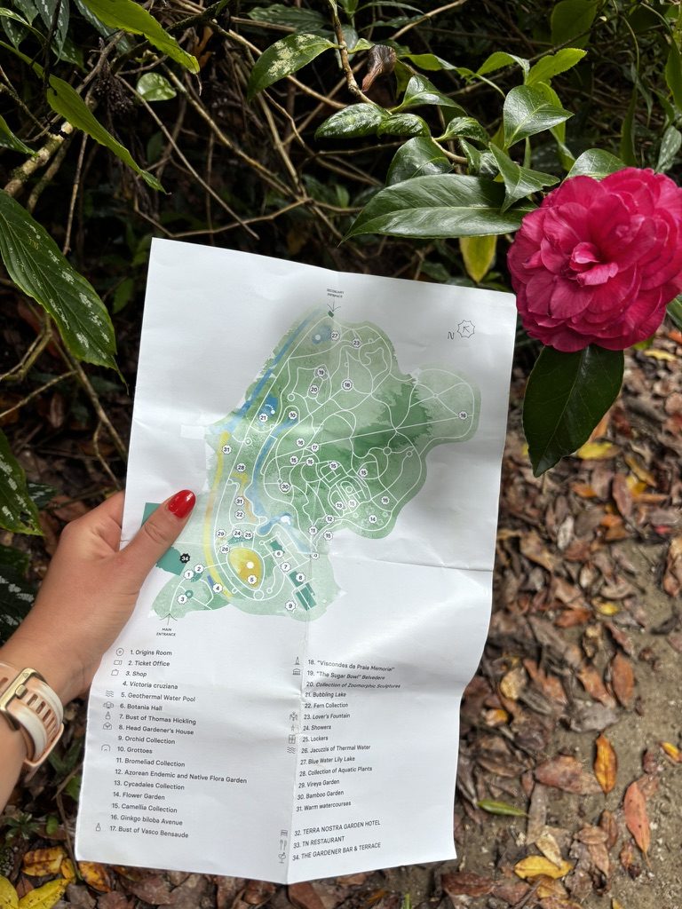 Anca following a park map through a beautiful green path in Sao Miguel