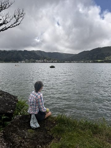 A quiet, still moment in the Azores — Anca sitting alone, looking out at the landscape