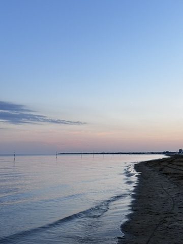 Early morning light in Caorle — golden sunrise over the Adriatic, the town just waking up