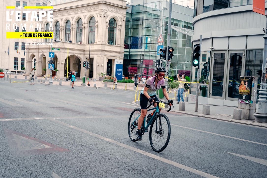 Anca racing through central Bucharest in L'Etape Romania by Tour de France, bib number 944