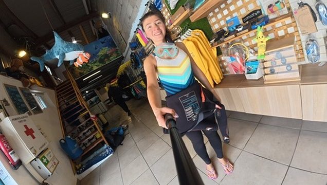 Anca gearing up for snorkelling off Tenerife, mask and fins, clear blue water ahead