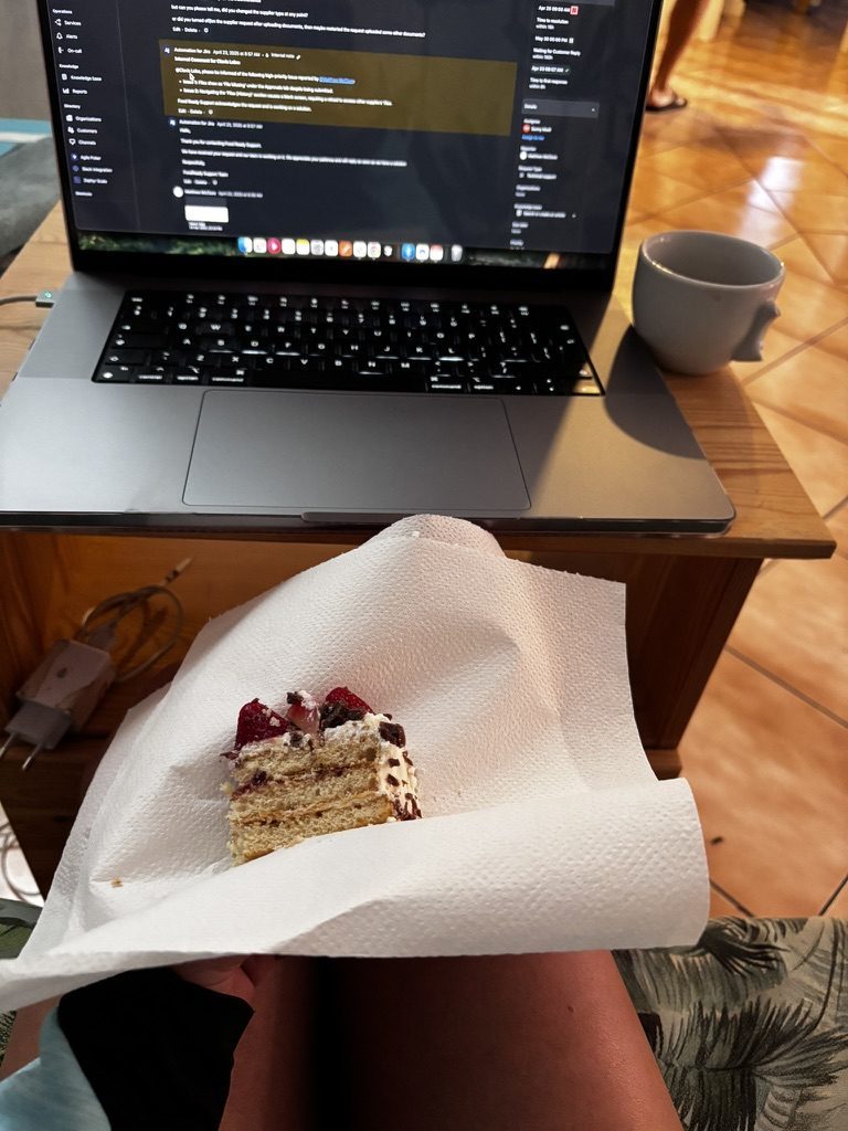 Anca at a coworking space in Tenerife, slightly distracted, with a shared cookie on the desk