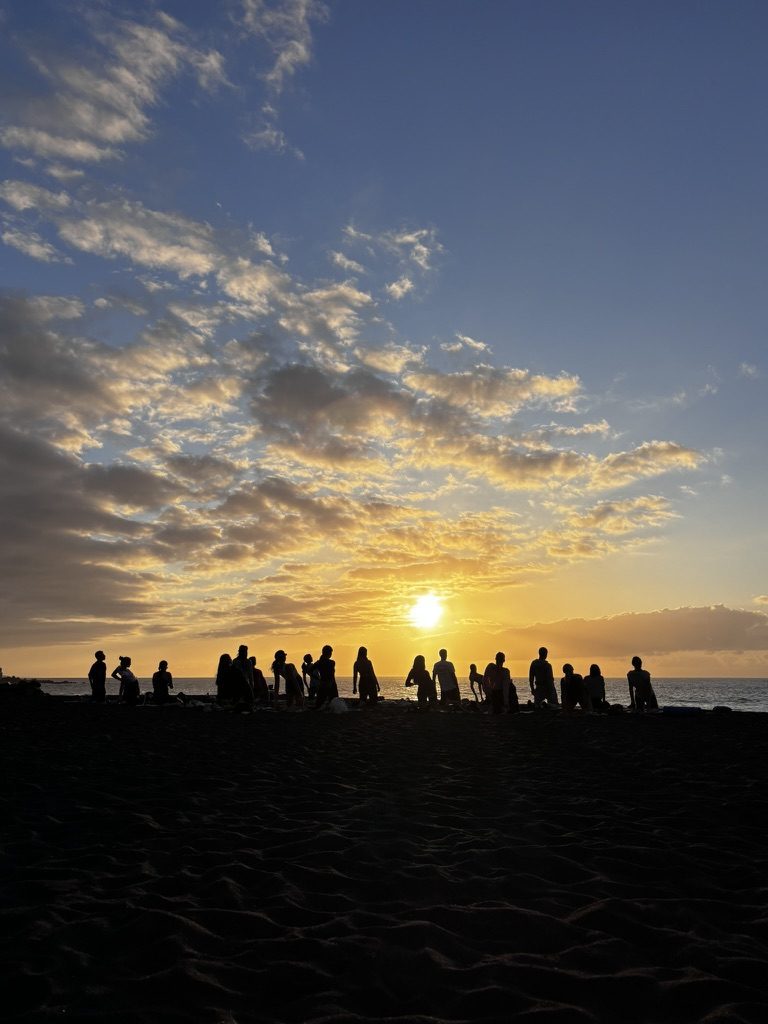Anca doing yoga silhouetted against a Tenerife sunset