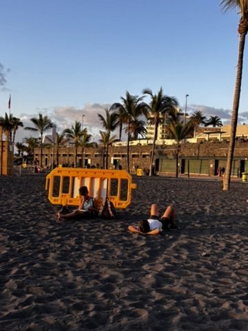 Children at the beach in Tenerife, completely absorbed in the sea and sand, zero awareness of anything else
