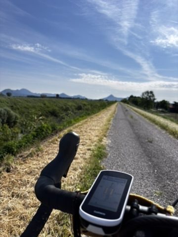 Endless gravel paths stretching through the Veneto countryside near Venice — flat, quiet, boundless