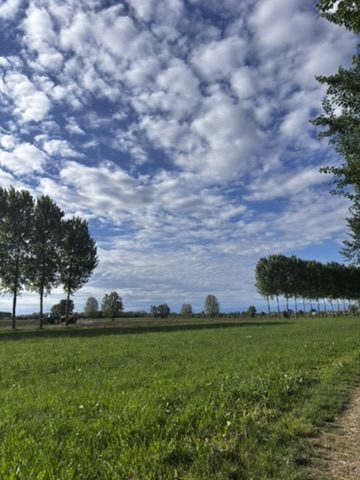Green gravel paths under a blue Veneto sky — the route at its most beautiful and its most deceptive